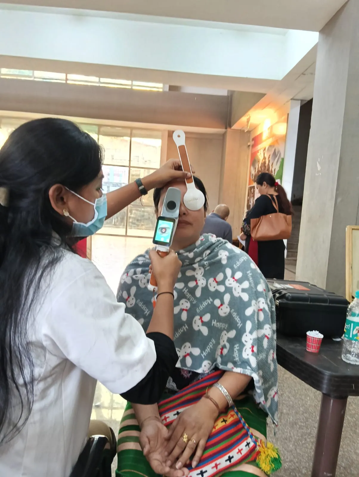 Senior citizen receiving free diagnostic testing.